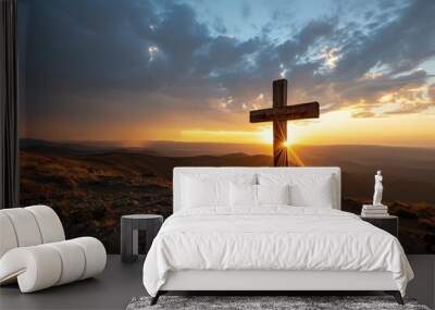 a cross on a hill with the sun shining through it Wall mural