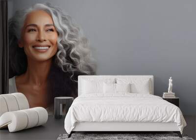 Black middle age woman portrait with healthy face skin. Open smiling beautiful aging mature woman with long hair. Beauty and cosmetics skincare advertising concept Wall mural