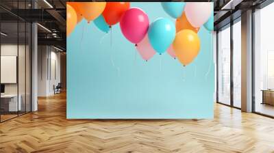 colourful balloons isolated on empty blue wall background with copy space Wall mural