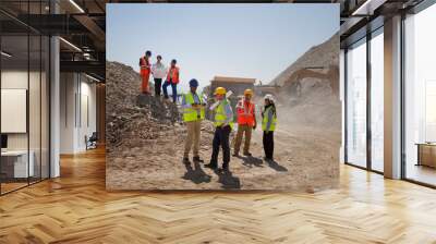 Business people and workers talking in quarry Wall mural