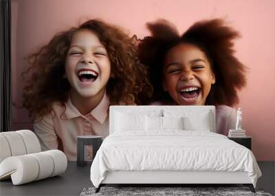 interracial portrait of 2 young girls laughing together Wall mural