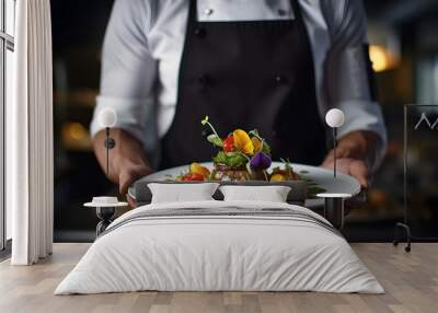 Modern food stylist decorating meal for presentation in restaurant. Close up of food stylish. Restaurant serving. Close-up on the hand of a waiter carrying food Wall mural