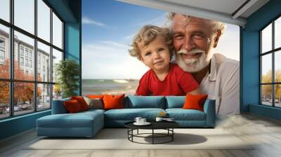 portrait of grandfather with grandchild on beach Wall mural