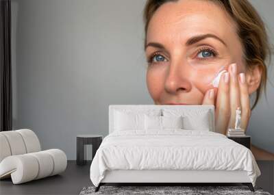 woman with cream swoosh on her cheek  Wall mural