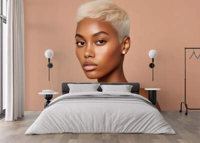 Young adult happy Black woman beauty female model, pretty cool gen z African lady with short blond hair healthy face skin and nose piercing looking at camera isolated at beige background Wall mural