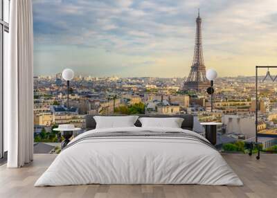 Aerial view of Paris with Eiffel Tower and Champs Elysees from the roof of the Triumphal Arch. Panoramic sunset view of old town of Paris. City skyline. Popular travel destination Wall mural