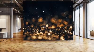 Golden christmas glittering particles with bokeh for a holiday on black background. Shiny golden New Year lights Wall mural