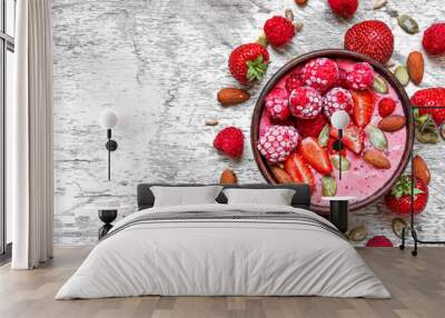 Smoothie bowl with red berries - strawberry and frozen raspberry, nuts and seeds. healthy breakfast Wall mural