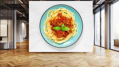 Spaghetti bolognese on a blue plate on white marble table. healthy food. top view Wall mural