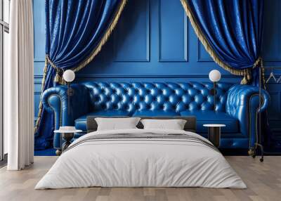 Blue tufted leather chesterfield sofa in a blue room with blue and gold curtains. Wall mural