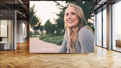 Beautiful young woman at the park  Wall mural