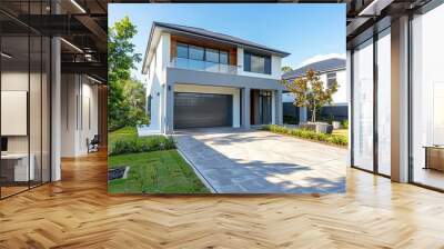 bright two storey modern house with driveway and garage, Showcasing modern architectural design and development.,Front view of a modern stylish white house with walkway to front door,  Wall mural