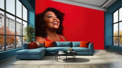 Plus size black woman smiling for the camera facing a red backdrop, in the style of booru, fash wave  Wall mural