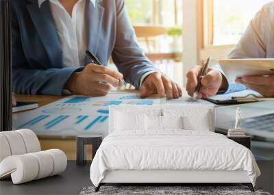 Small business owner discussing a business loan with a bank representative. Wall mural