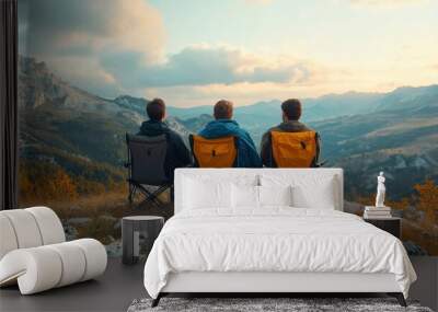 three friends sit in camping chairs on top of a mountain, travelers enjoy nature and cuddle, tourists look into distance on background of panoramic landscape, weekend concept, Generative AI Wall mural