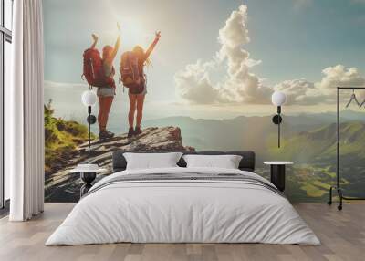 Epic mountain landscape with two hikers celebrating on top Wall mural