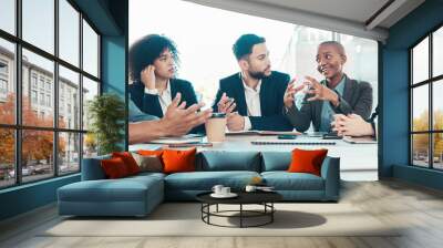 I have a different approach to the problem. Shot of a diverse group of businesspeople sitting in the office together and having a meeting. Wall mural