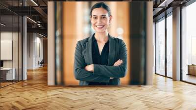 Portrait, smile and arms crossed with a professional business woman in her corporate workplace. Happy, vision and confident with a happy female employee standing in her office wearing a power suit Wall mural