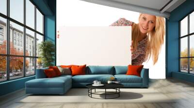 nde woman holding a blank white board in her hands for promotion Wall mural