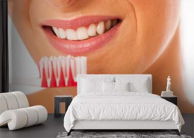 Woman cleaning teeth with toothbrush for perfect hygiene and hea Wall mural