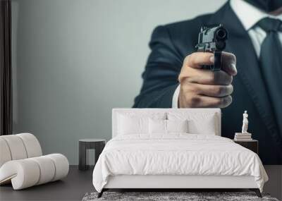 Man in a suit holding a handgun, background in soft focus, concept of security, protection, crime, enforcement, and authority. Wall mural