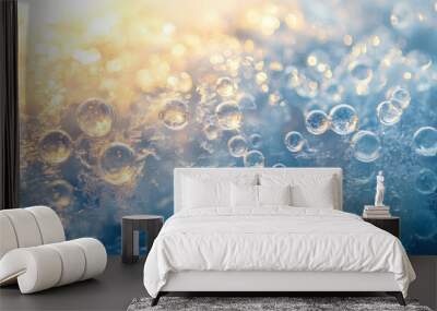 A close-up view of air bubbles frozen beneath ice, with rays of sunshine creating an abstract scene of warmth, hope, and life Wall mural