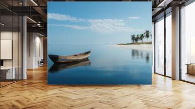 A lonely wooden boat floating on the still sea, with a serene white sand beach and palm trees in the background under a cloudless sky Wall mural