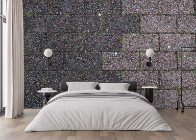 Two tone of brick in gray color with gravel texture and some green of grass for background Wall mural