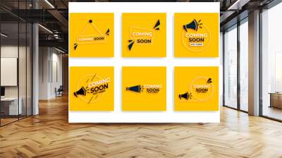 Coming soon with megaphone design. Vector illustration on yellow background Wall mural