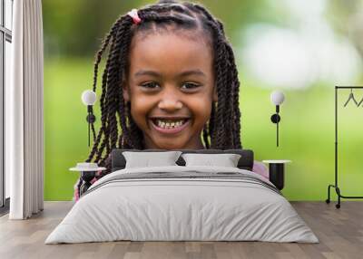 Outdoor close up portrait of a cute young black girl - African p Wall mural