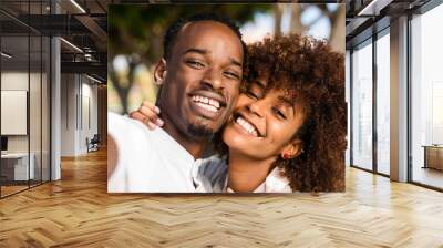 Outdoor protrait of black african american couple  taking a selfie Wall mural