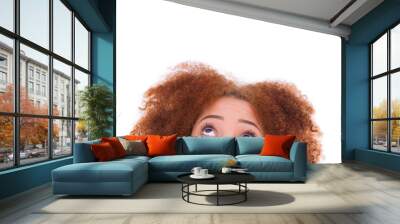 Young hispanic teenage girl looking up isolated on white backgro Wall mural