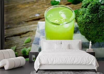 Glass of broccoli juice, broccoli Healthy drink on wood back ground, Green vegetable smoothie Wall mural