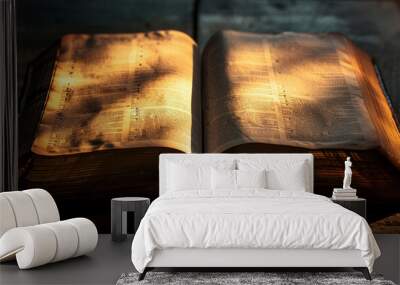 .A deeply moving close-up photograph capturing the interplay of sunlight and shadows on the open pages of a Bible in a dark room Wall mural