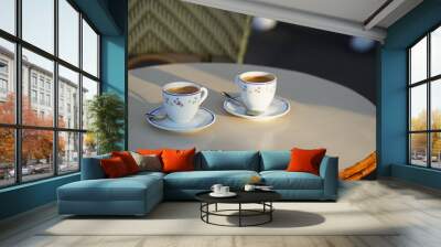 Two cups of espresso coffee on a coffee shop terrace from Paris, France. Wall mural