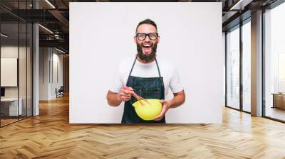 Portrait of a happy young crazy chef cook isolated on a white background Wall mural