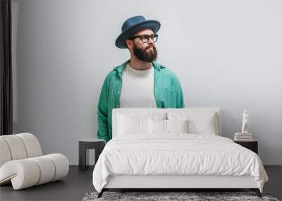 Young bearded hipster guy wearing white blank t shirt with copy space for your text or logo. Mockup for design Wall mural