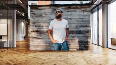 Young bearded hipster guy wearing white blank t-shirt. Mock-up for print. T-shirt template. Wall mural