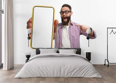 Young crazy bearded charismatic hipster showing big empty white smartphone screen for copy space and advertising area. Mobile App Advertisement. Display Mock Up Wall mural