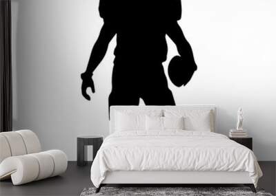  A silhouette of a male football player in a uniform , standing in a ready stance Wall mural