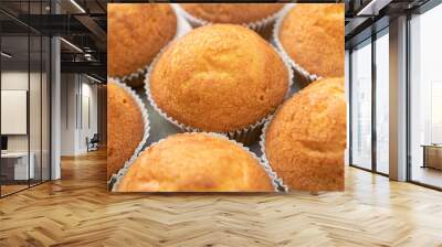 Pattern from baked muffins in close-up. Fresh pastries.  Wall mural