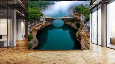 A mystical river, with fog rising from the water and ancient stone bridges crossing it, disappearing into the misty distance Wall mural