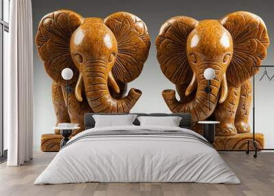 A pair of springstone bookends, carved into the shape of elephants, holding up volumes on nature and wildlife Wall mural