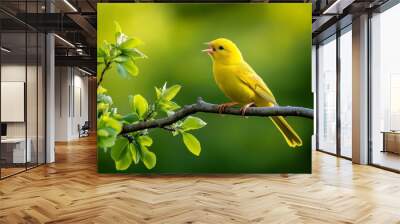 A yellow bird perched on a tree branch, singing in the morning light, symbolizing joy and cheerfulness Wall mural