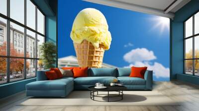 A yellow ice cream cone, melting slightly under the sun, symbolizing sweet summer fun Wall mural