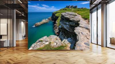 British Isles coastline with a view of Tintagel Castle, perched dramatically on the cliffs above the wild Cornish sea Wall mural