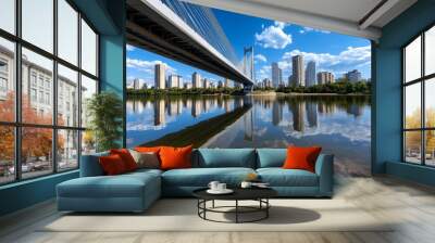 Panoramic photo, city bridge, spanning a river shows the engineering marvel and the connection between two sides of a city Wall mural