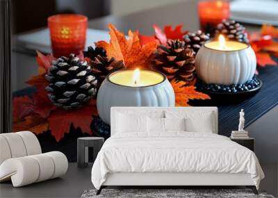 Thanksgiving dinner table with candles, autumn leaves, and pumpkins, creating a warm, festive atmosphere for the holiday meal Wall mural