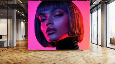 Stylish woman with modern bob hairstyle and vibrant lighting. Wall mural