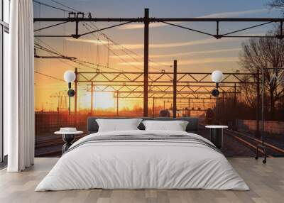 Railroad tracks at a station at a winter sunrise. Wall mural